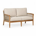 Sofa dwuosobowa z drewna teak z beżowymi poduszkami